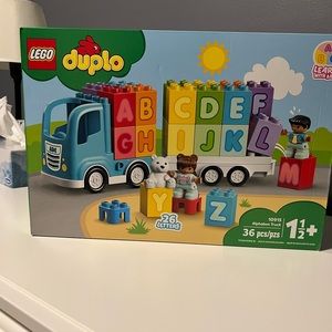 BNIB Retired item. Duplo alphabet truck.